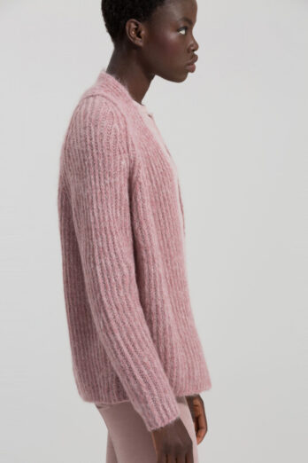 Luisa Cerano's short cardigan in a soft mohair/alpaca blend, in a ribbed pattern, with long raglan sleeves. The cardigan is unbuttoned at the front.